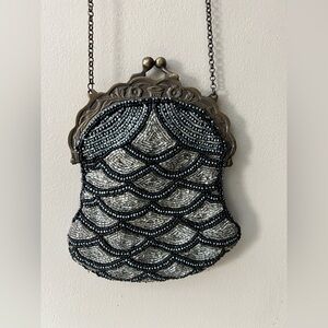Vintage 1920’s-1940’s beaded evening clutch with kiss lock on a metal frame.